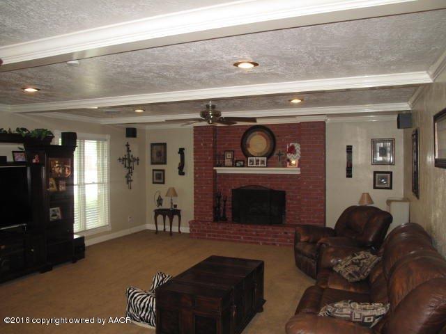 6306 Jameson Road Amarillo, TX 79106 - Photo 11 of 32 a living room with furniture and a fireplace