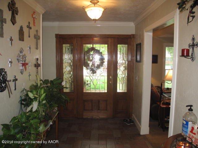 6306 Jameson Road Amarillo, TX 79106 - Photo 13 of 32 an empty room with windows and outdoor view