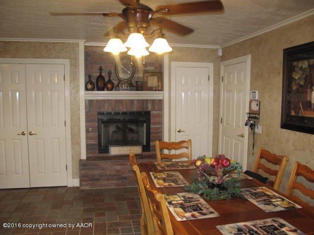 6306 Jameson Road Amarillo, TX 79106 - Photo 20 of 32 a living room with furniture and a fireplace