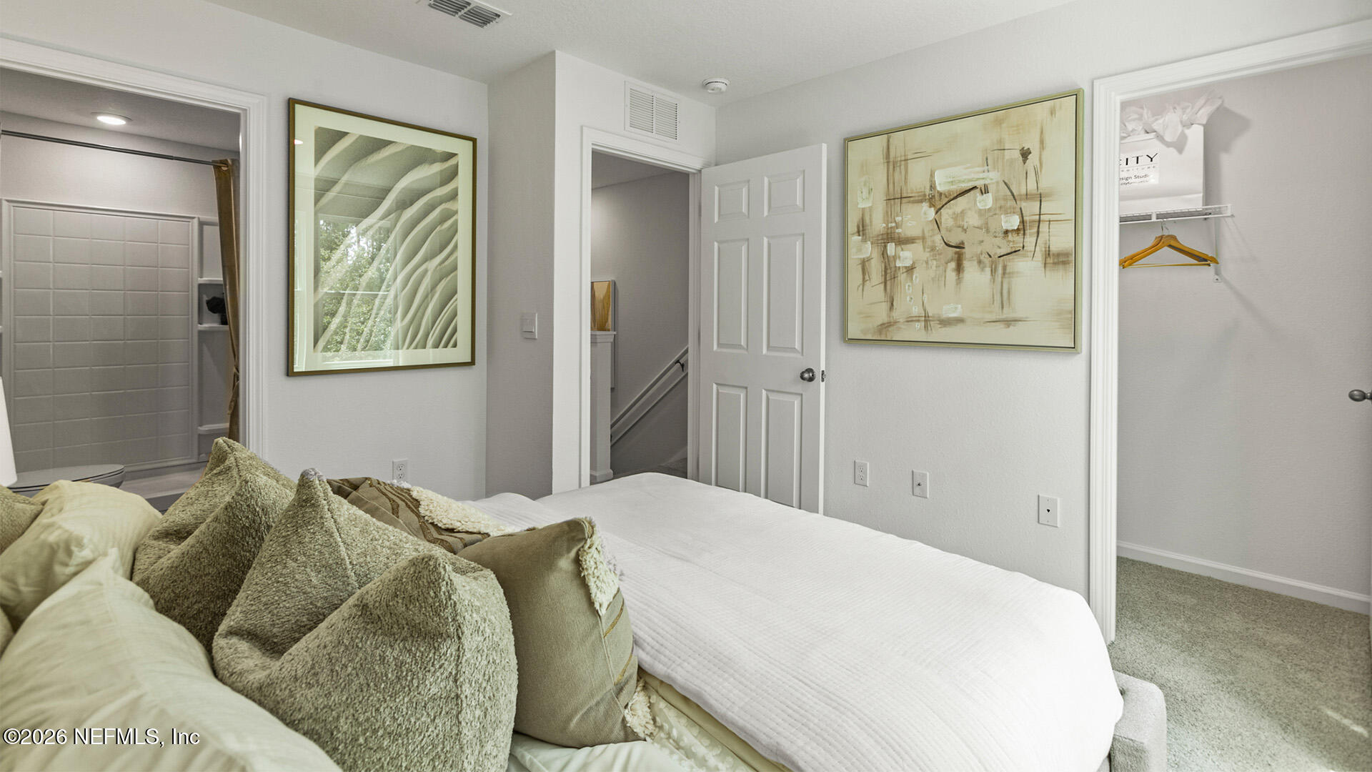 185 Ayamonte Road St. Augustine, FL 32084 - Photo 20 of 37 a bed sitting in a bedroom next to a window