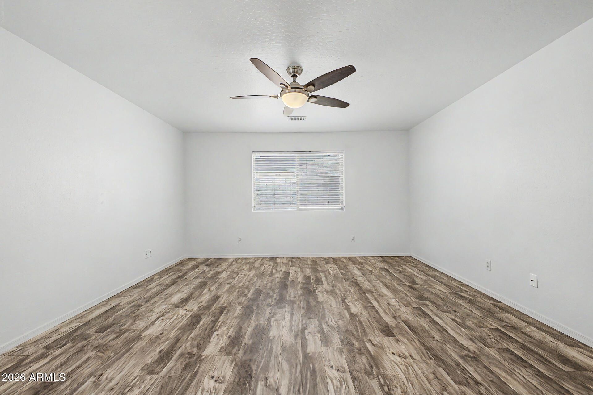 1882 West Rd Agent Street Apache Junction, AZ 85120 - Photo 12 of 26 wooden floor in an empty room with a window