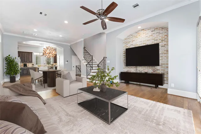 a living room with fireplace furniture and a flat screen tv