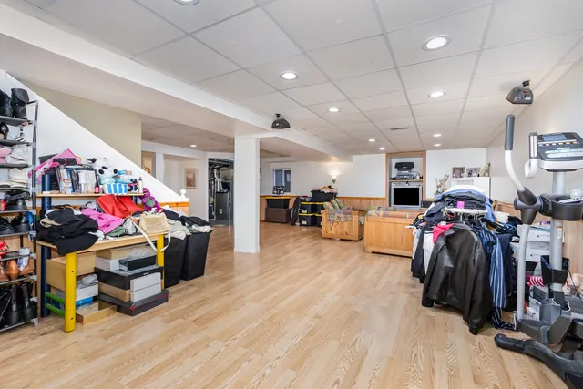 a living room with lots of furniture and clutter