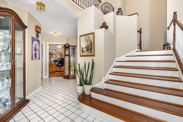 a view of entryway with furniture and wooden floor
