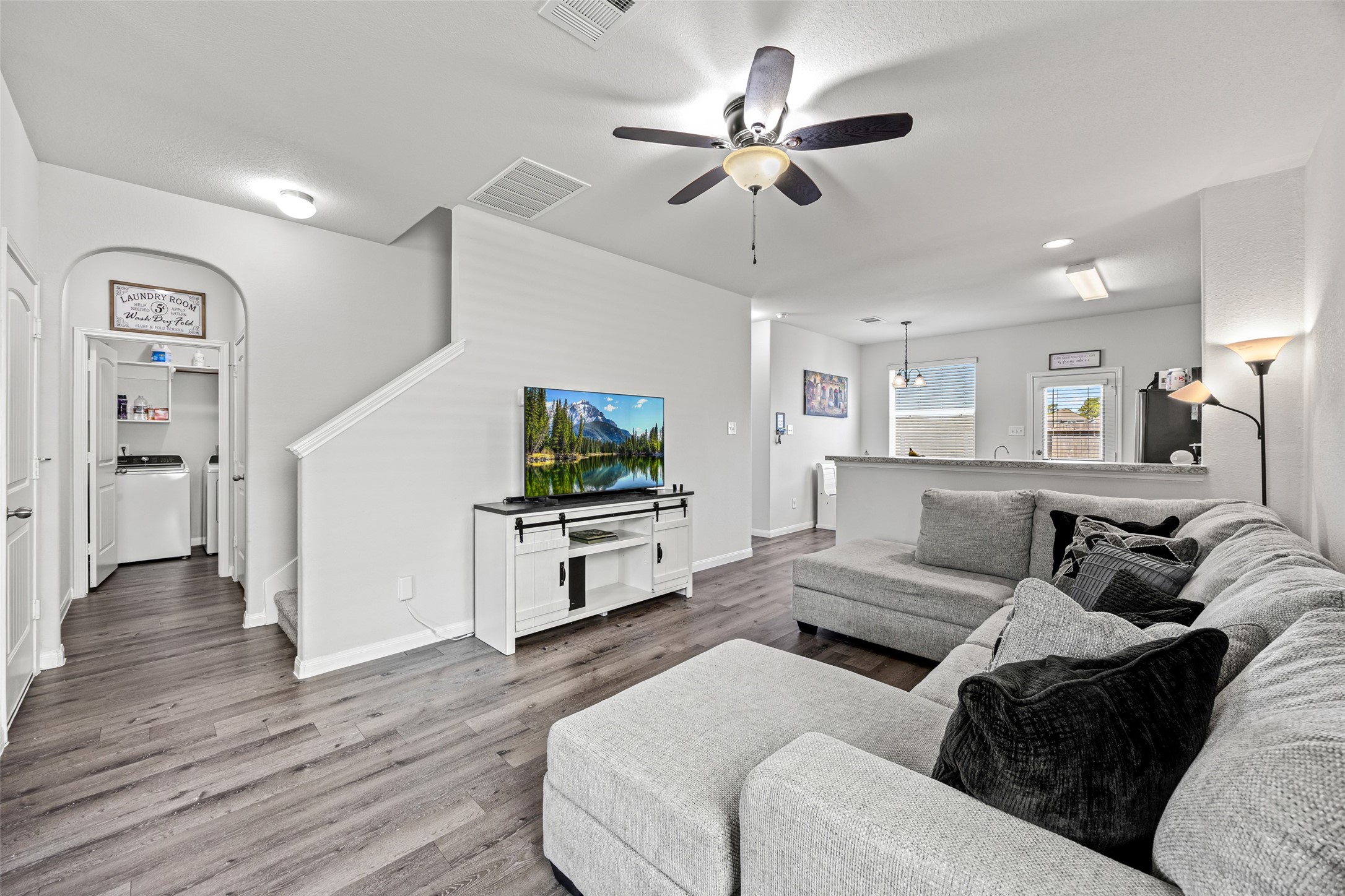 a living room with furniture and a flat screen tv