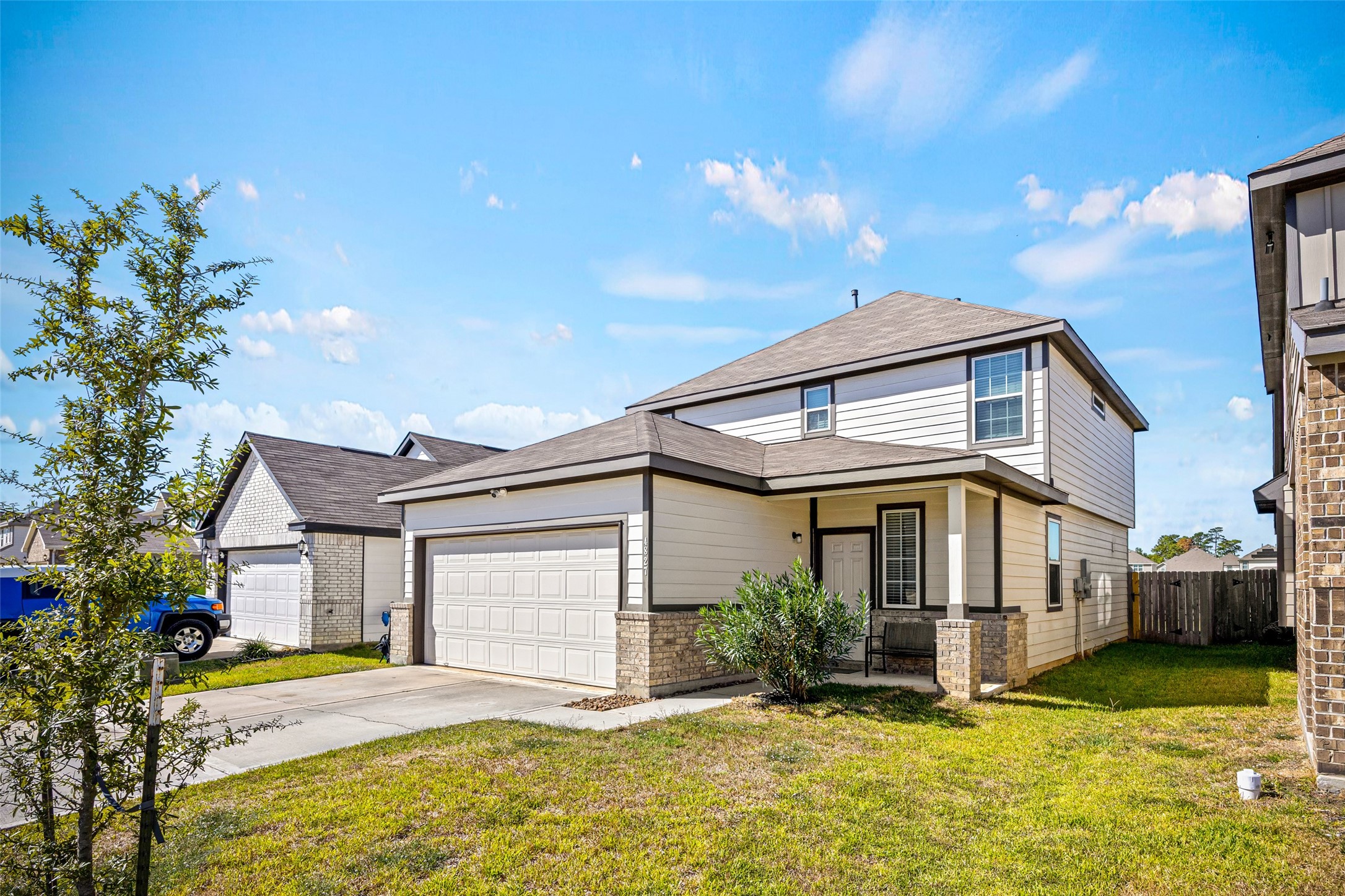 4827 Purple Wisteria Lane Spring, TX 77373 - Photo 2 of 26 a front view of house with yard and swimming pool