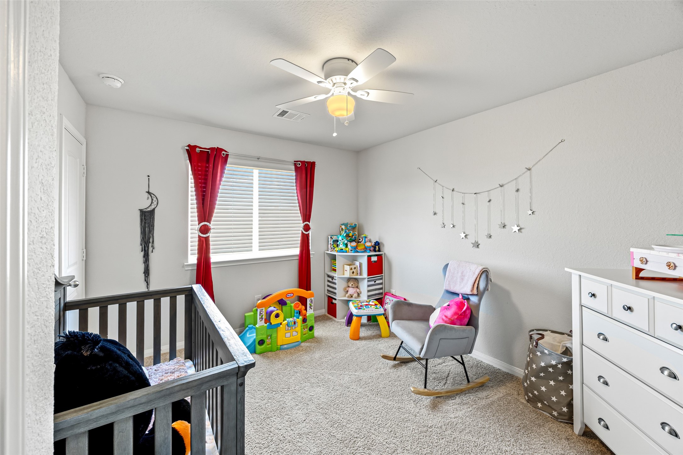 4827 Purple Wisteria Lane Spring, TX 77373 - Photo 22 of 26 a bedroom with furniture and a chandelier