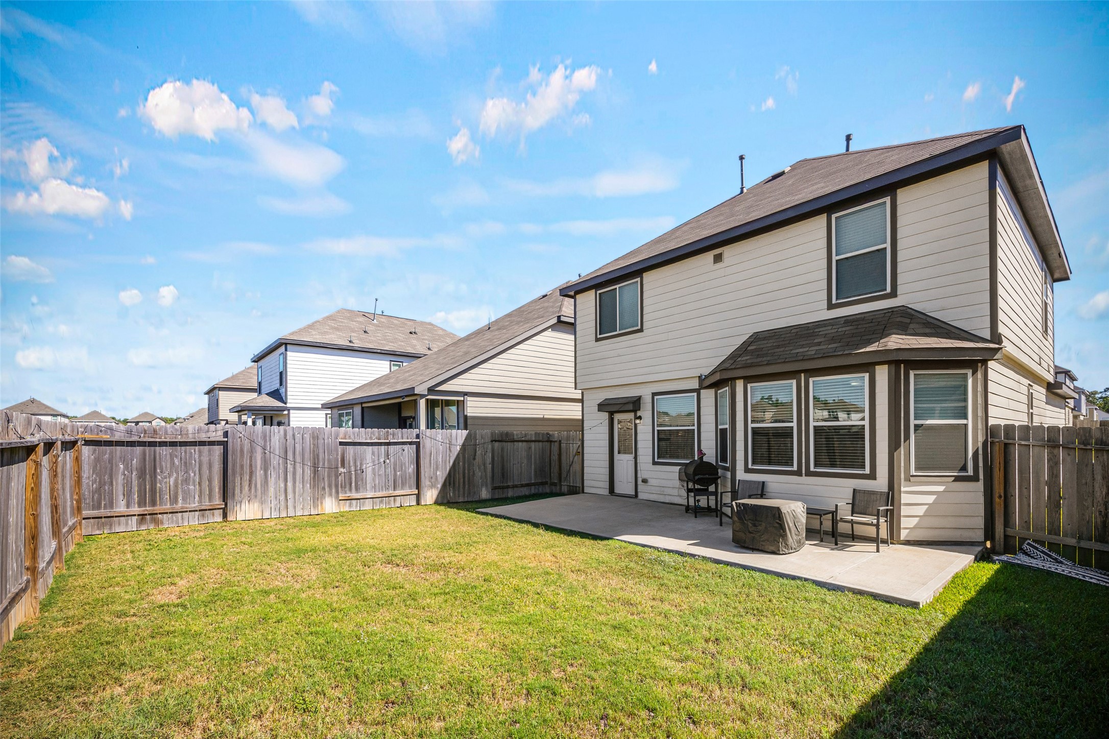 4827 Purple Wisteria Lane Spring, TX 77373 - Photo 26 of 26 a view of a house with a backyard and a patio