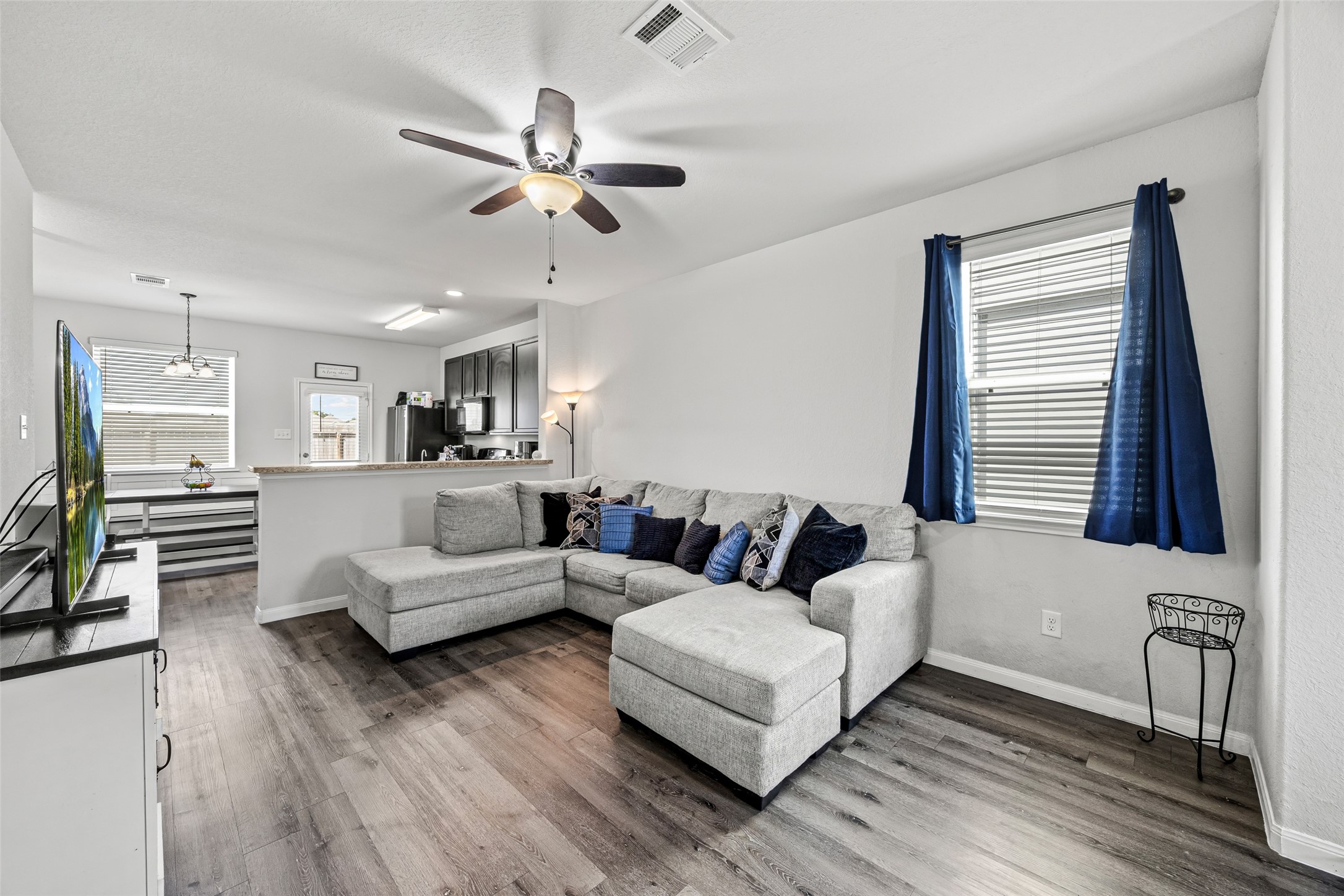 4827 Purple Wisteria Lane Spring, TX 77373 - Photo 10 of 26 a living room with furniture and a large window