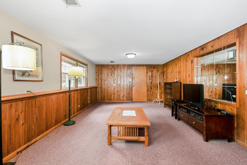 7213 West 109th Street Worth, IL 60482 - Photo 11 of 23 a living room with furniture and a flat screen tv