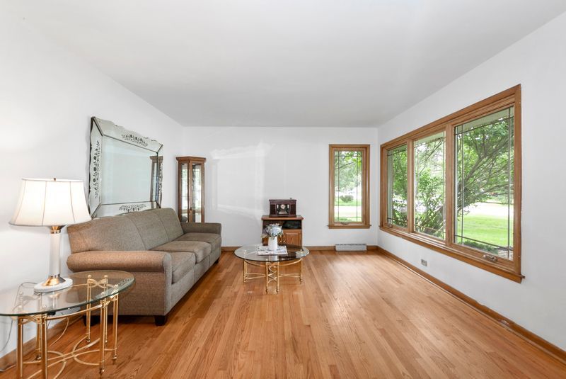 7213 West 109th Street Worth, IL 60482 - Photo 6 of 23 a living room with furniture and a large window