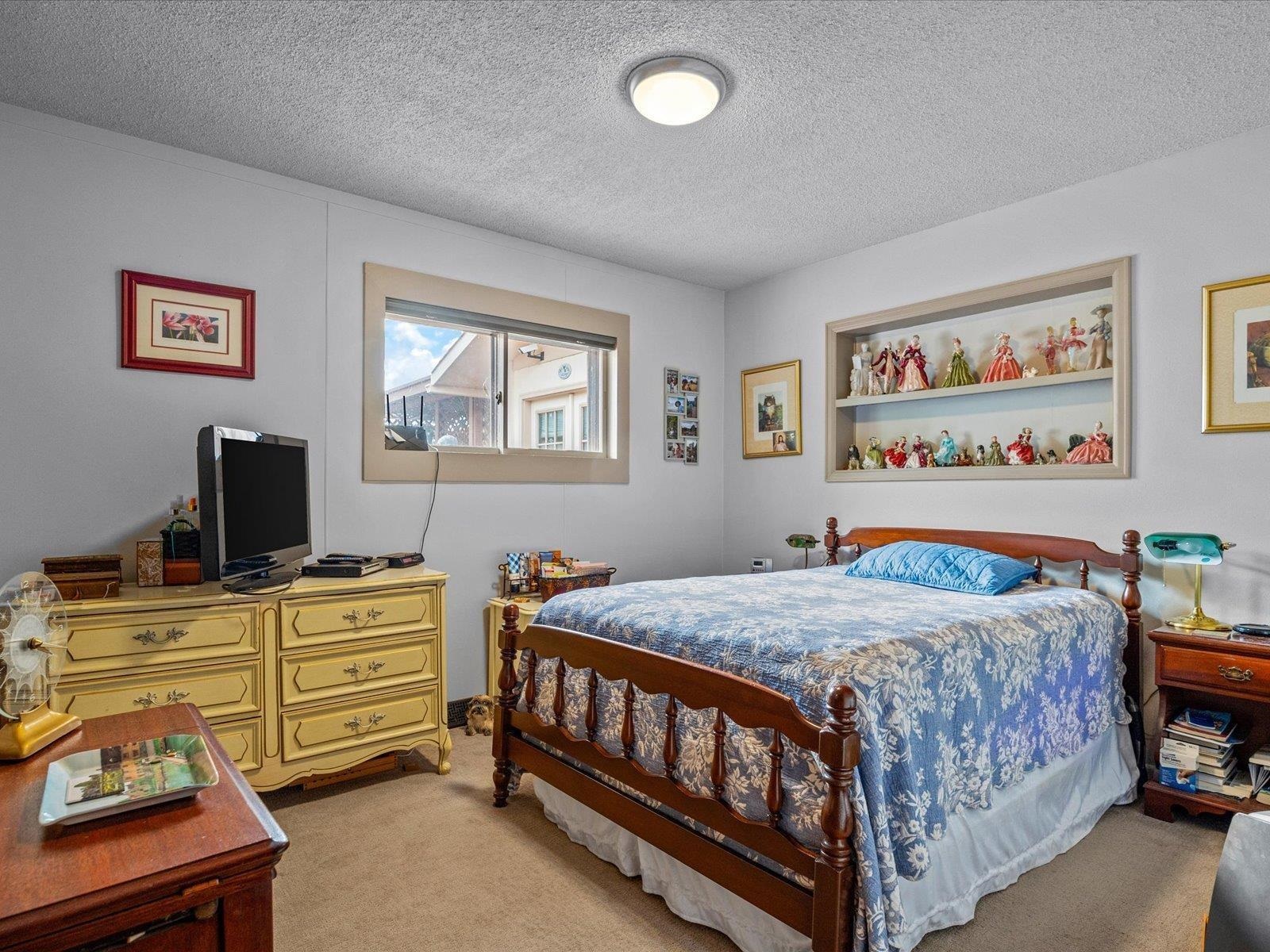 3085 F F 1/2 Road Grand Junction, CO 81504 - Photo 15 of 30 a bedroom with a bed and a tv