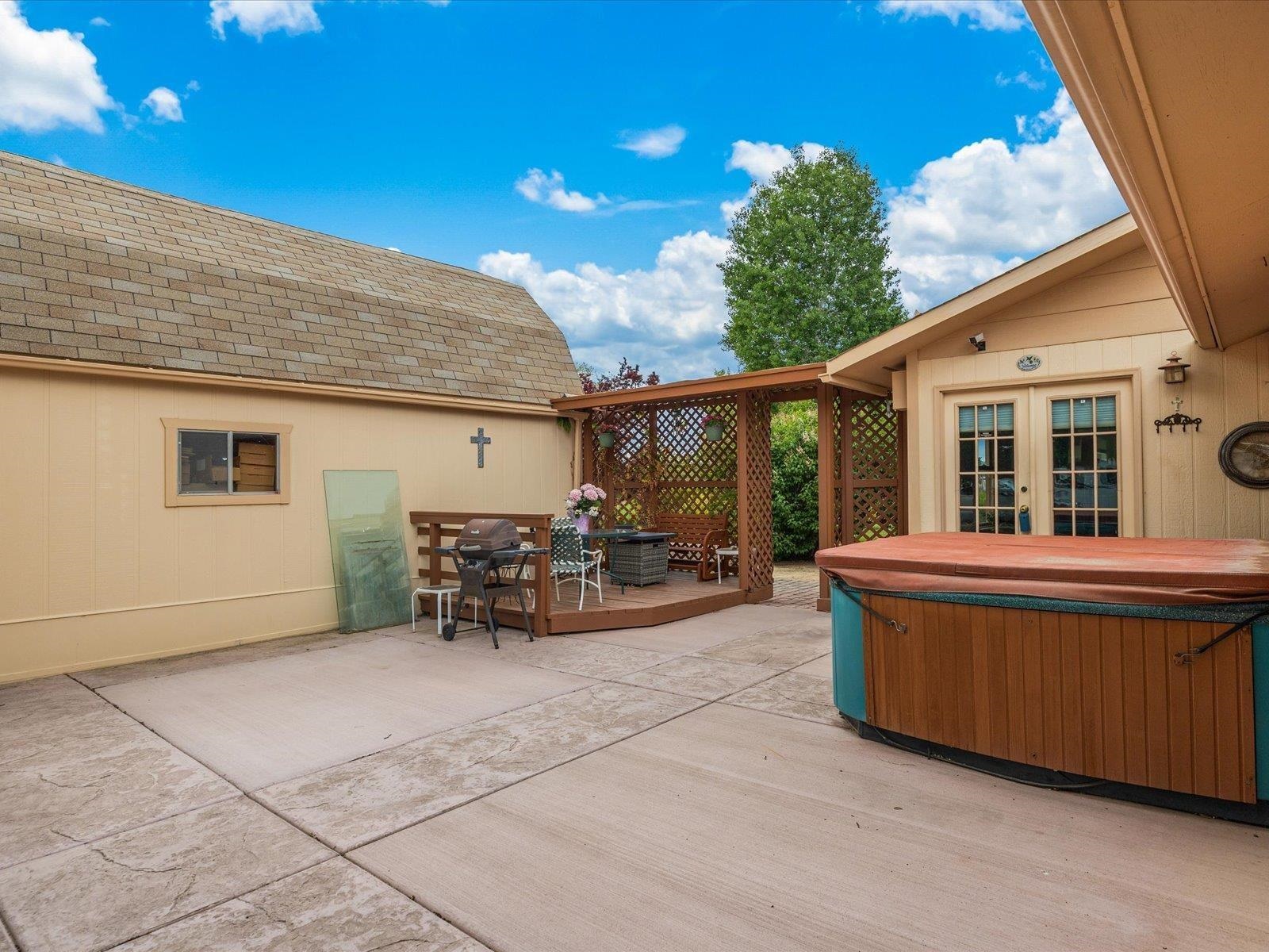 3085 F F 1/2 Road Grand Junction, CO 81504 - Photo 19 of 30 a view of a patio with table and chairs and potted plants
