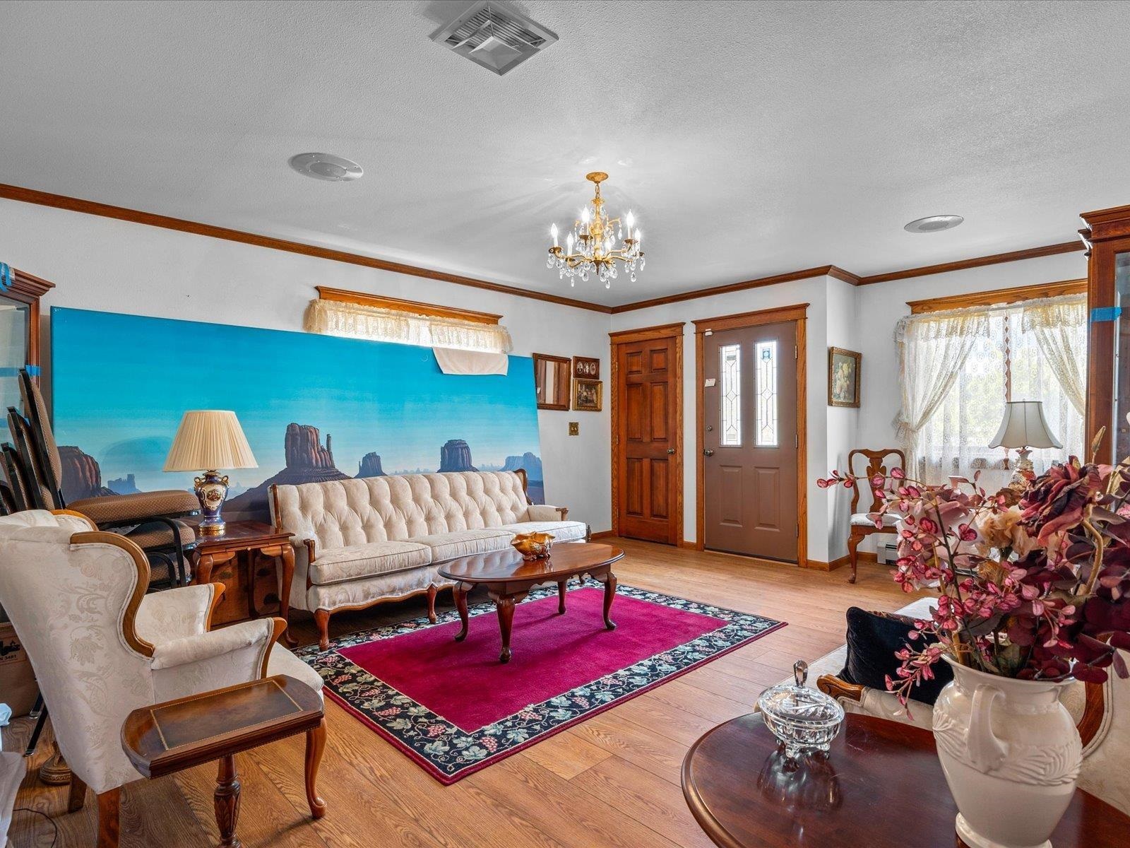 3085 F F 1/2 Road Grand Junction, CO 81504 - Photo 10 of 30 a living room with furniture flowerpot and a chandelier