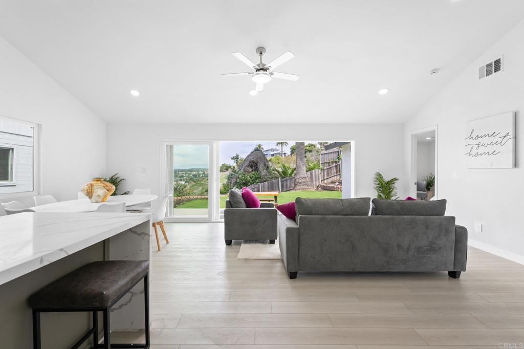 1326 Crestridge Drive Oceanside, CA 92054 - Photo 14 of 29 a living room with furniture and a large window