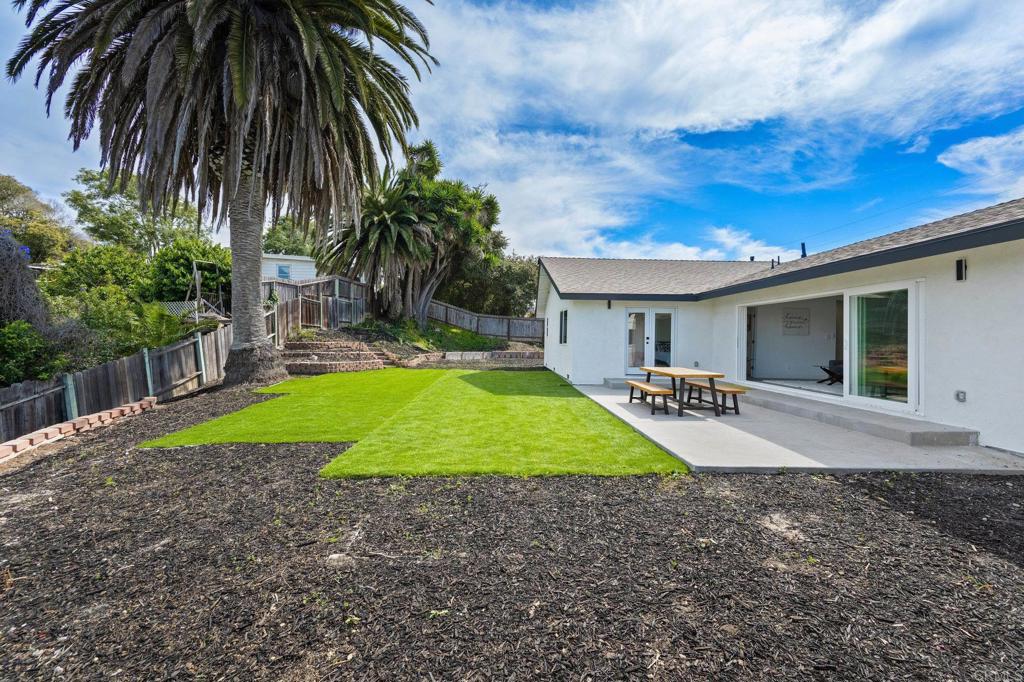 1326 Crestridge Drive Oceanside, CA 92054 - Photo 20 of 29 a view of a backyard with a garden and plants