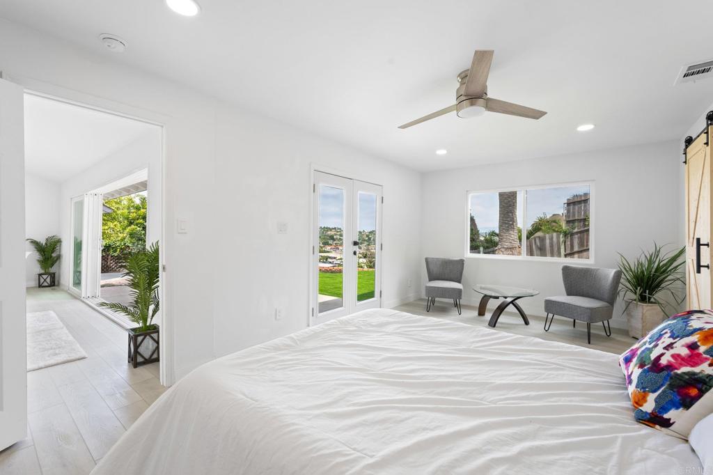 1326 Crestridge Drive Oceanside, CA 92054 - Photo 26 of 29 a bedroom with a bed and ceiling fan