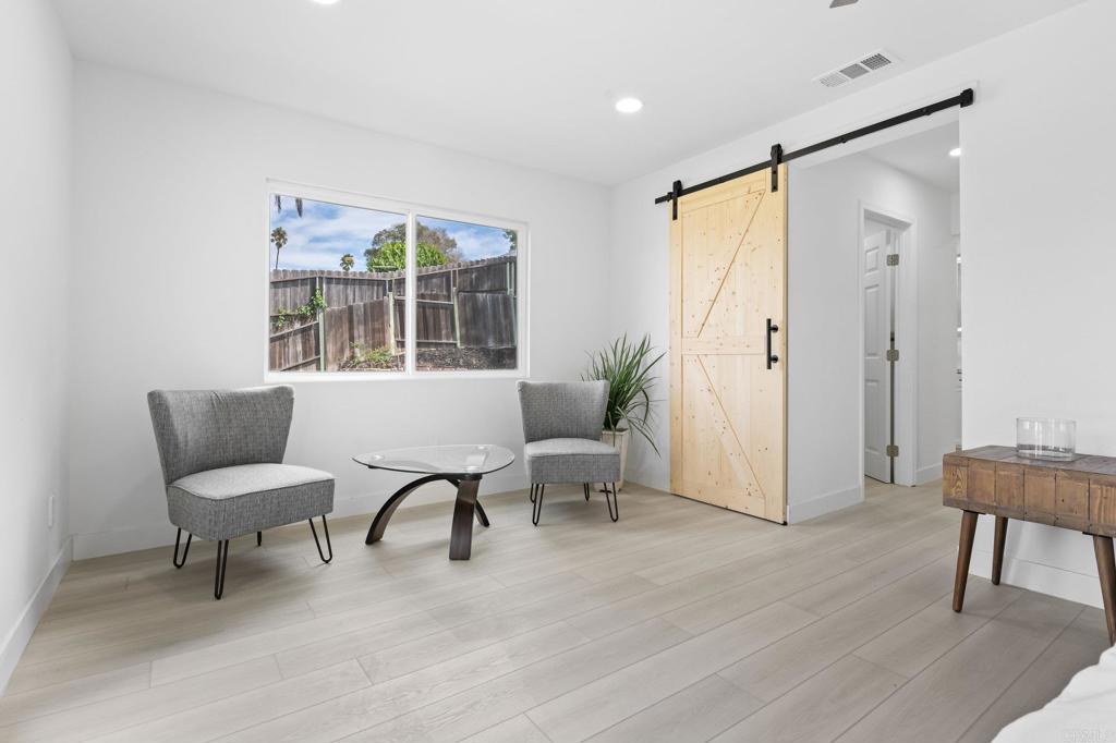 1326 Crestridge Drive Oceanside, CA 92054 - Photo 27 of 29 a living room with furniture and a window