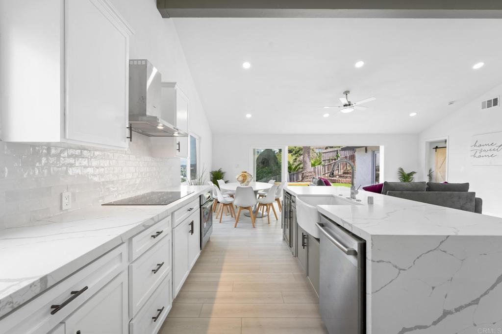 1326 Crestridge Drive Oceanside, CA 92054 - Photo 9 of 29 a large kitchen with stainless steel appliances a lot of counter space and a sink