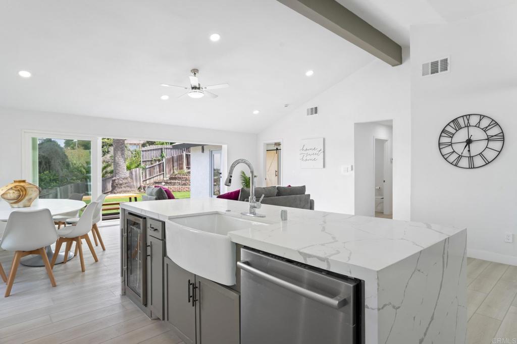 1326 Crestridge Drive Oceanside, CA 92054 - Photo 10 of 29 a kitchen with a stove a table and chairs