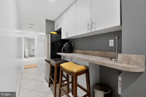 a kitchen with stainless steel appliances granite countertop a sink a stove and microwave