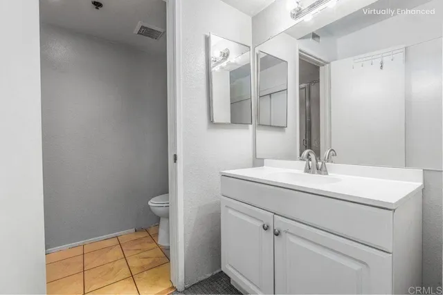 a bathroom with a sink toilet and vanity