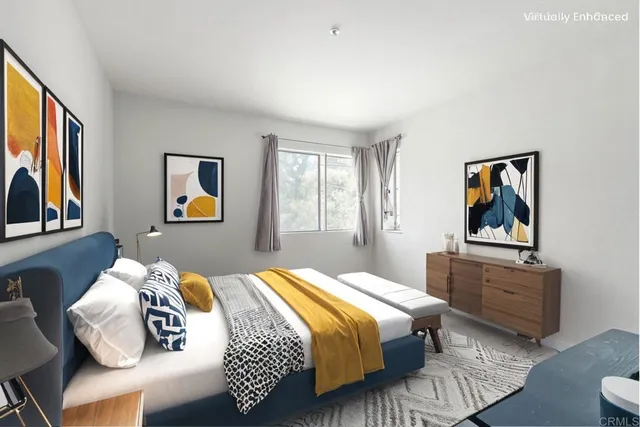 a bedroom with a bed and painting on the wall