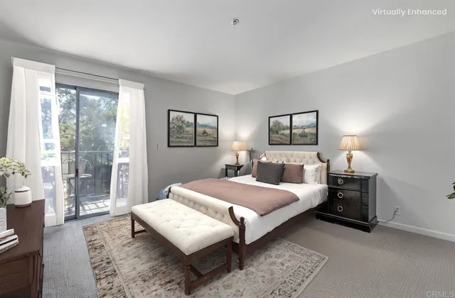 a bedroom with a large bed and a couch