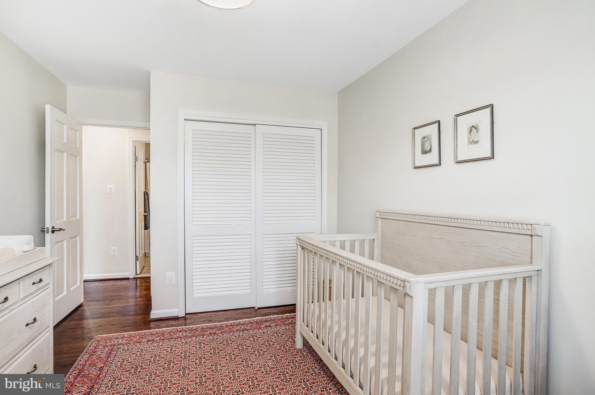 6737 Baron Road McLean, VA 22101 - Photo 19 of 36 a bedroom with a bed and wooden floor