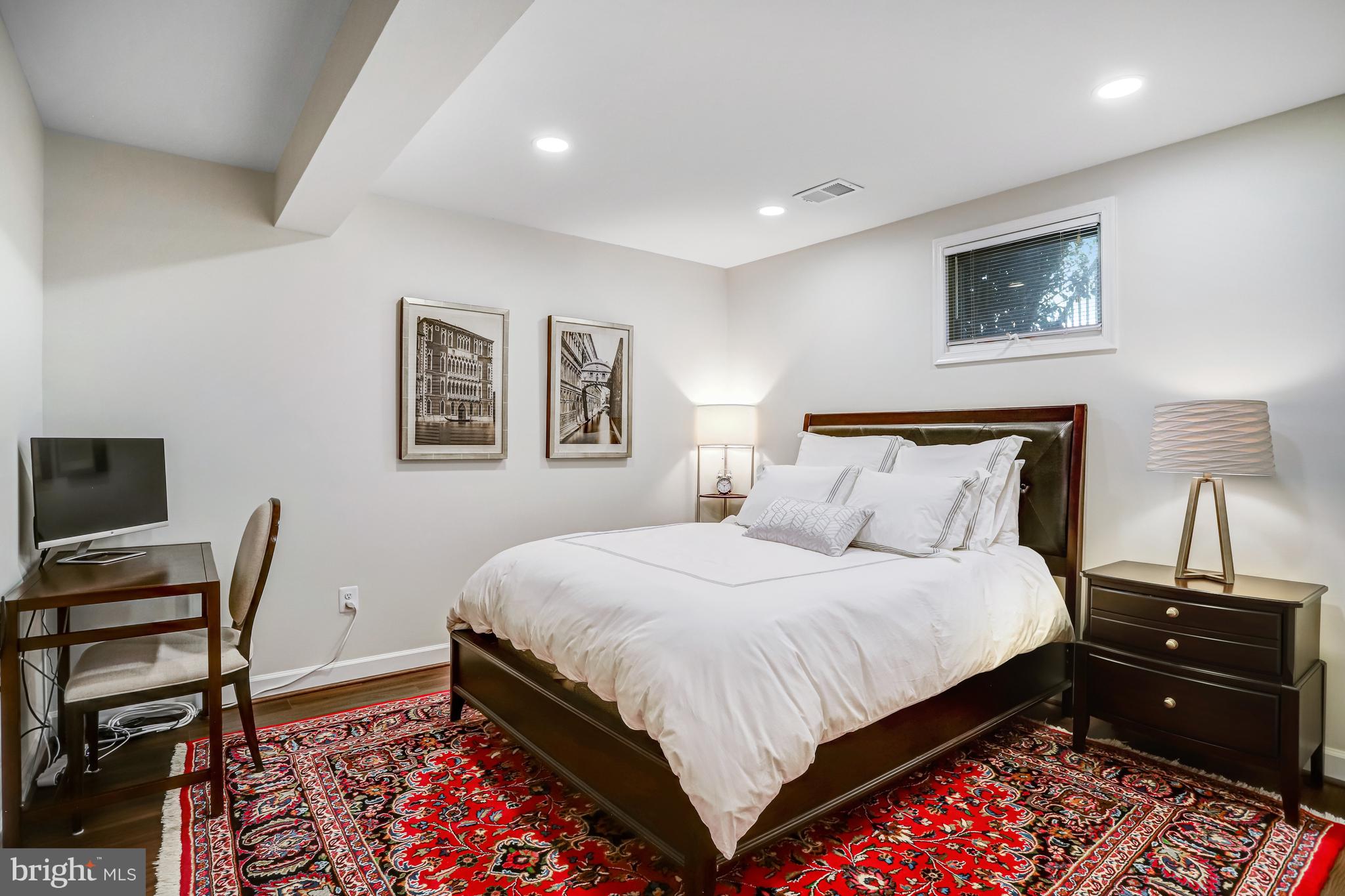 6737 Baron Road McLean, VA 22101 - Photo 24 of 36 a bedroom with a bed and wooden floor