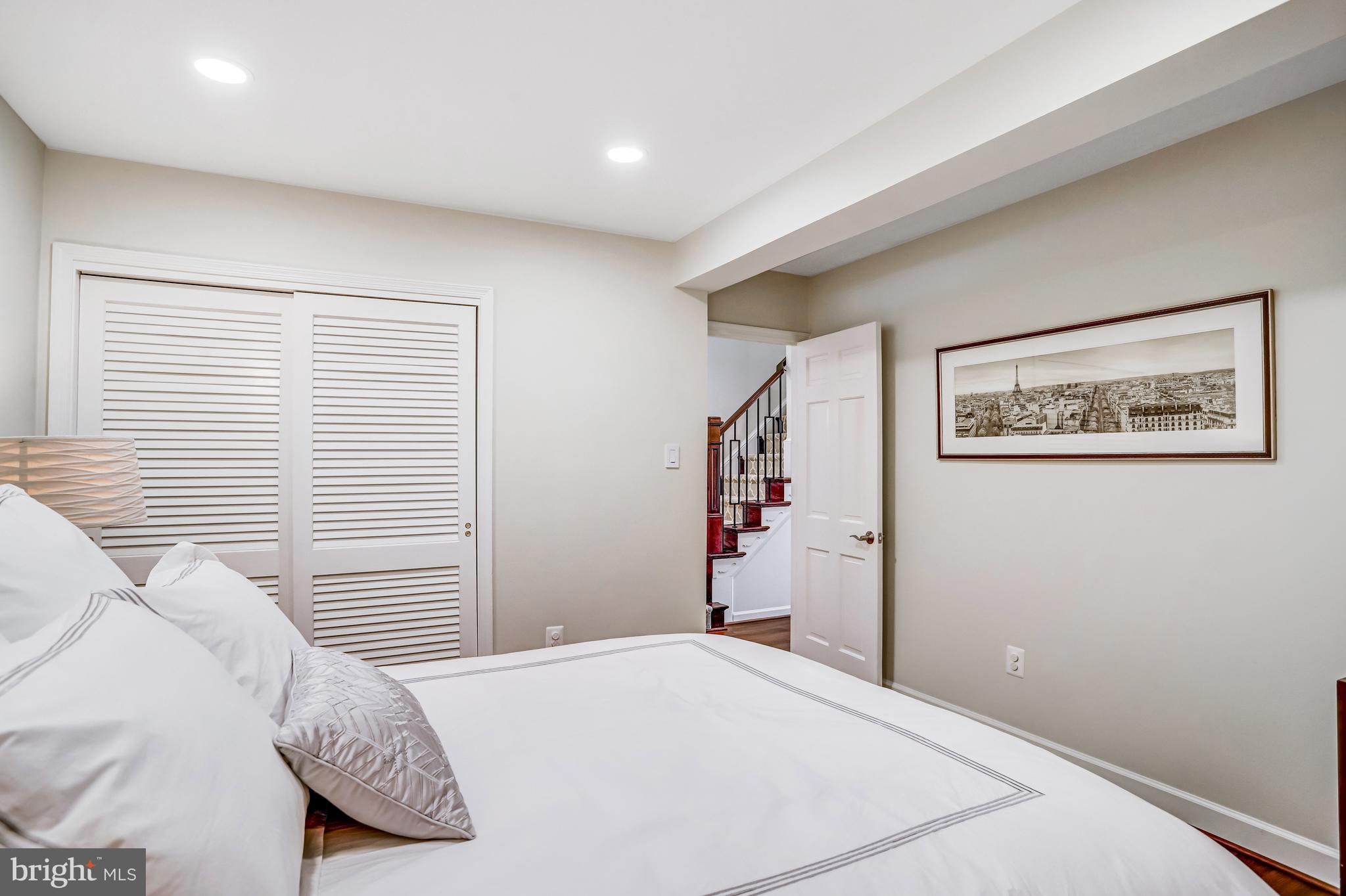 6737 Baron Road McLean, VA 22101 - Photo 25 of 36 a bedroom with a bed and a window