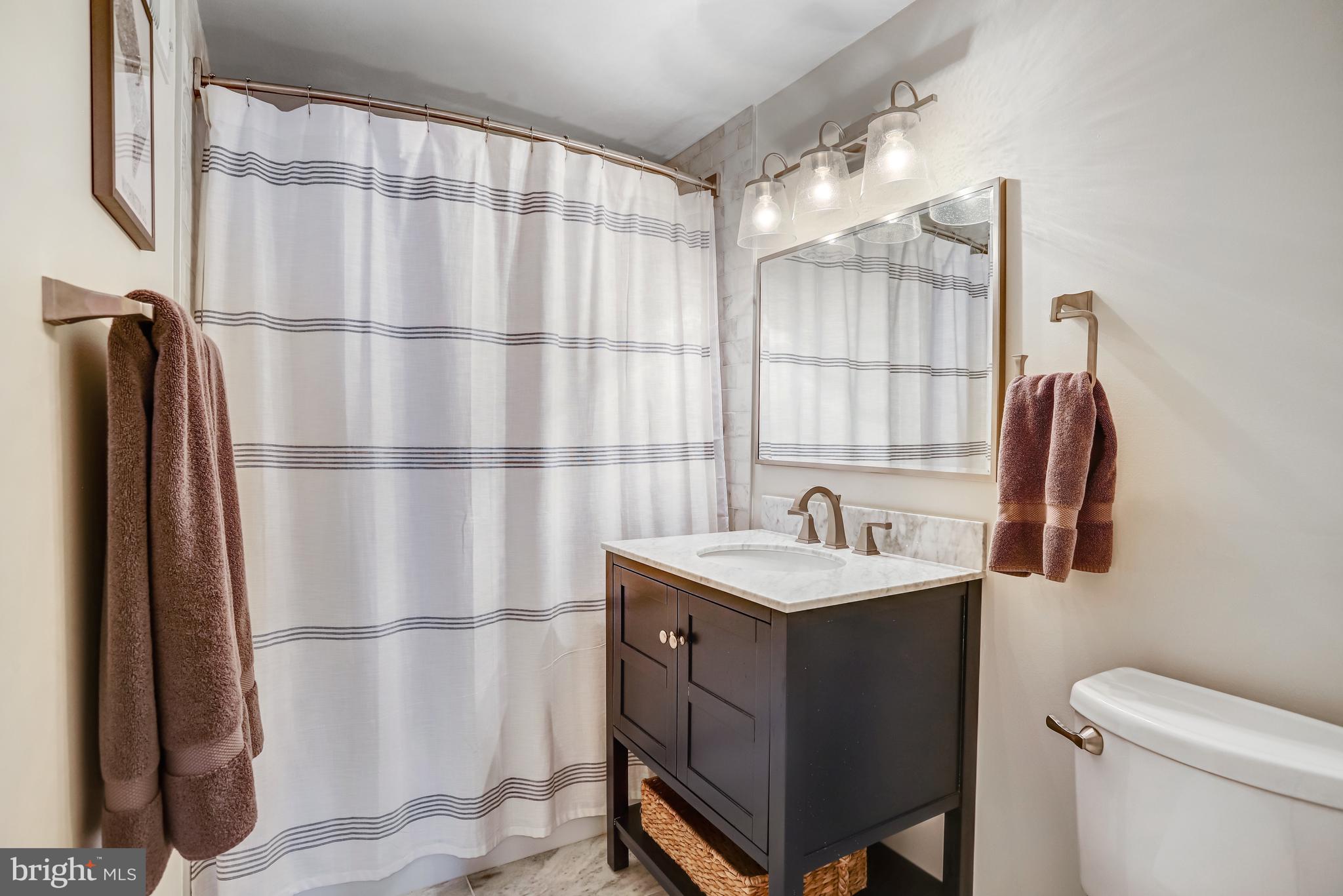 6737 Baron Road McLean, VA 22101 - Photo 26 of 36 a bathroom with a sink and a mirror