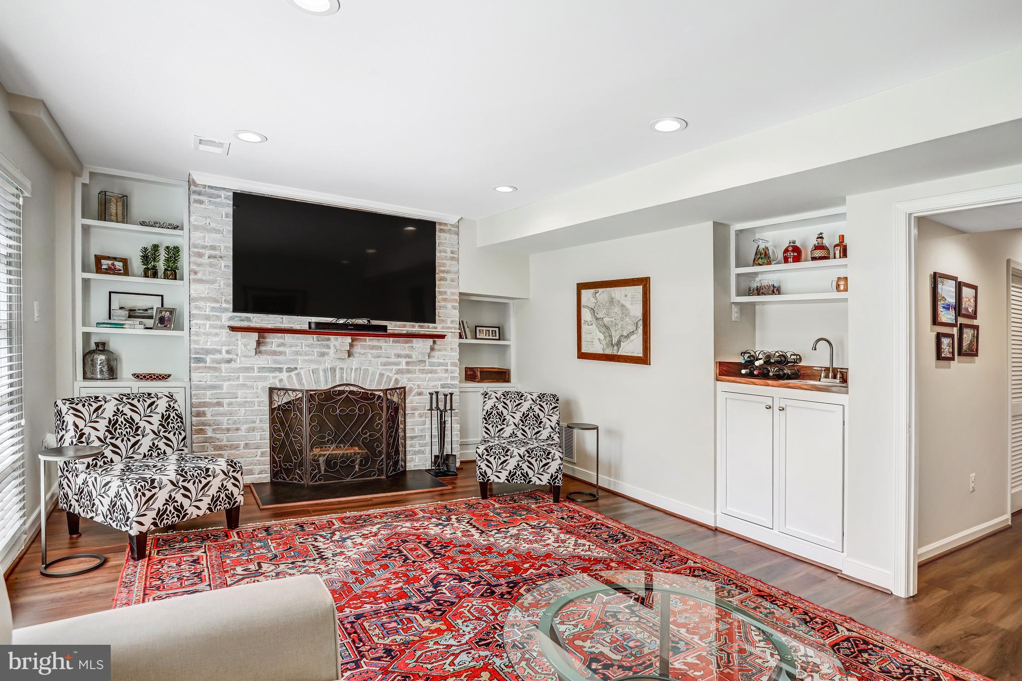 6737 Baron Road McLean, VA 22101 - Photo 28 of 36 a living room with furniture fireplace and flat screen tv