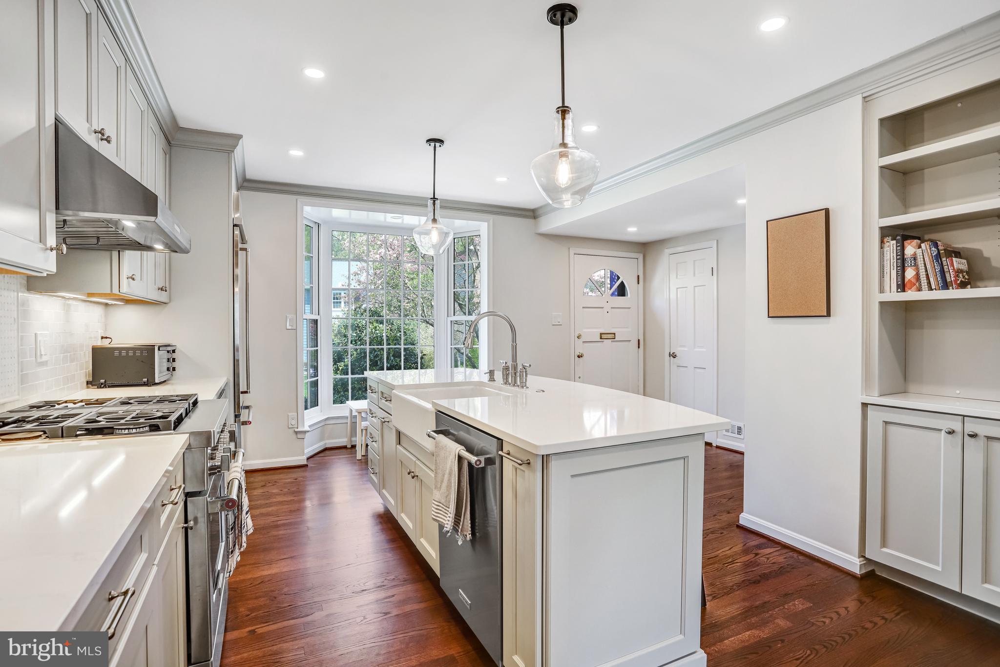 6737 Baron Road McLean, VA 22101 - Photo 8 of 36 a kitchen with a stove a sink a refrigerator and a window