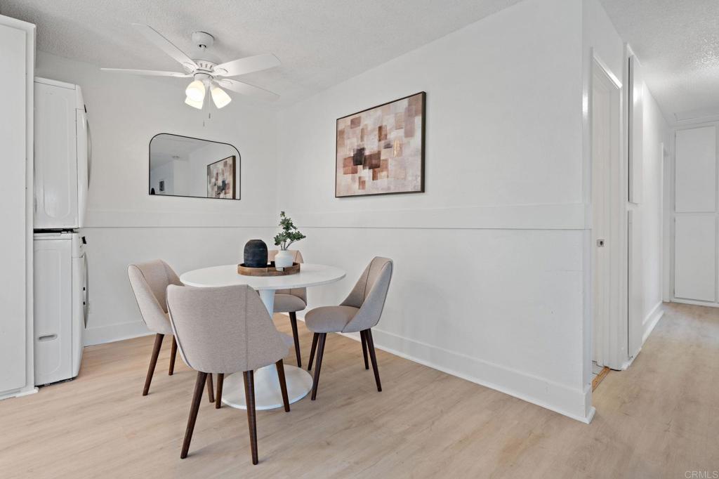 3408 Del Este Way Oceanside, CA 92056 - Photo 12 of 25 a view of a dining room with furniture and wooden floor