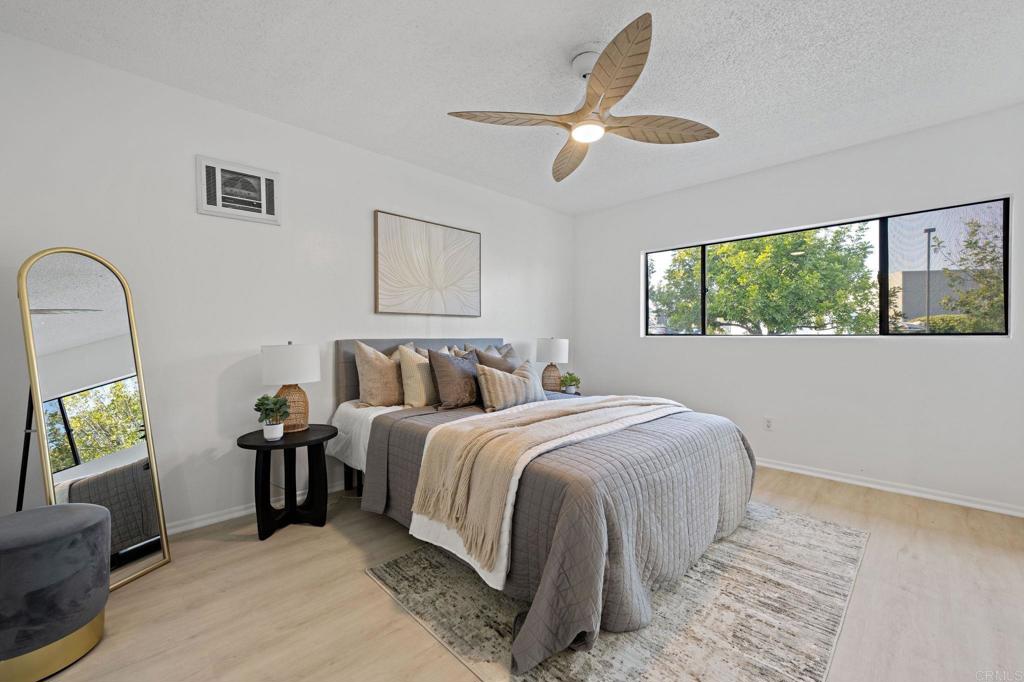 3408 Del Este Way Oceanside, CA 92056 - Photo 14 of 25 a bedroom with bed and a large window