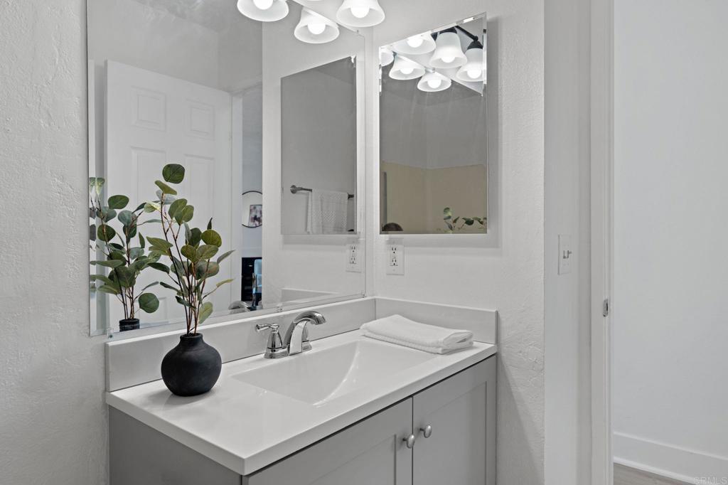 3408 Del Este Way Oceanside, CA 92056 - Photo 15 of 25 a bathroom with a sink a vanity and a mirror
