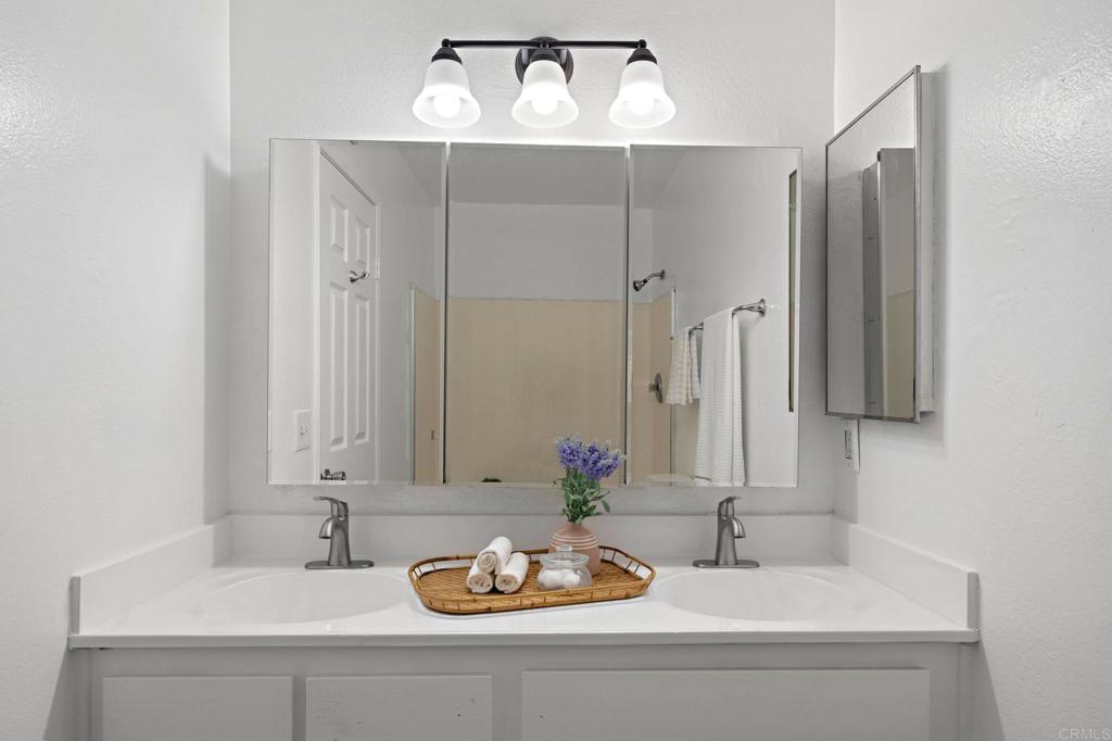 3408 Del Este Way Oceanside, CA 92056 - Photo 19 of 25 a bathroom with a sink and a mirror