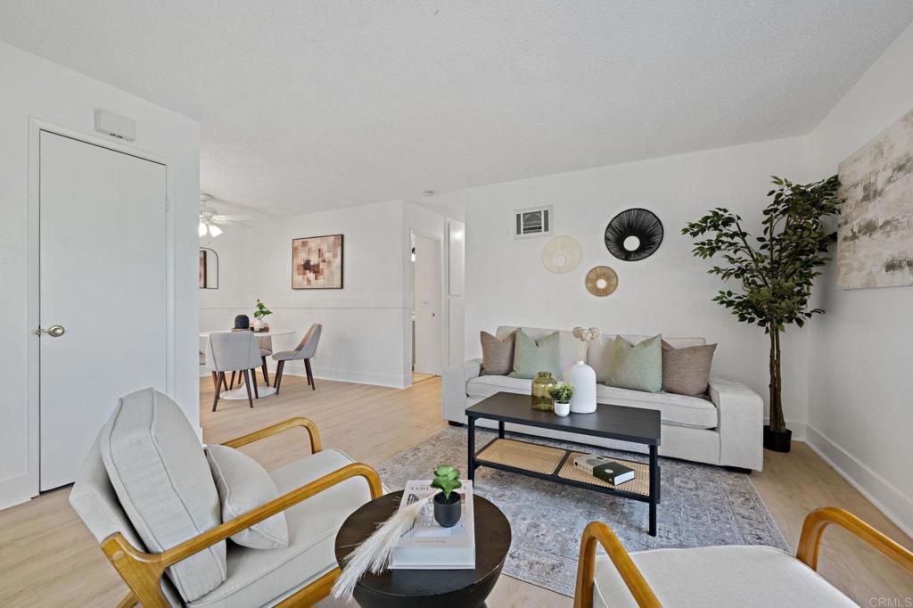 3408 Del Este Way Oceanside, CA 92056 - Photo 2 of 25 a living room with furniture and a table