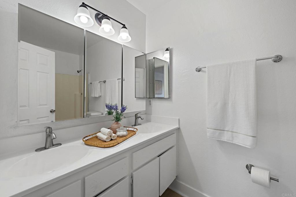 3408 Del Este Way Oceanside, CA 92056 - Photo 25 of 25 a bathroom with a sink and a mirror