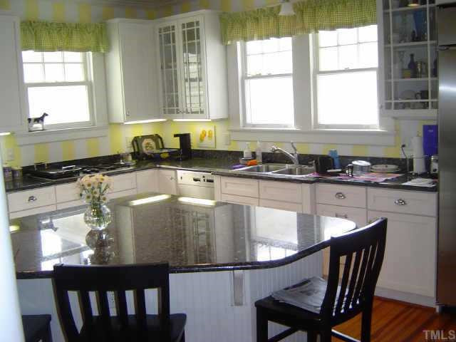 2106 Cowper Drive Raleigh, NC 27608 - Photo 2 of 12 Gourmet kitchen with work island and granite countertops Other