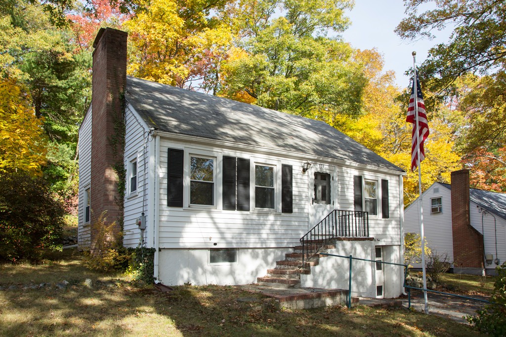 379 Marrett Road Lexington, MA 02421 - Photo 1 of 6 a front view of a house with a yard balcony