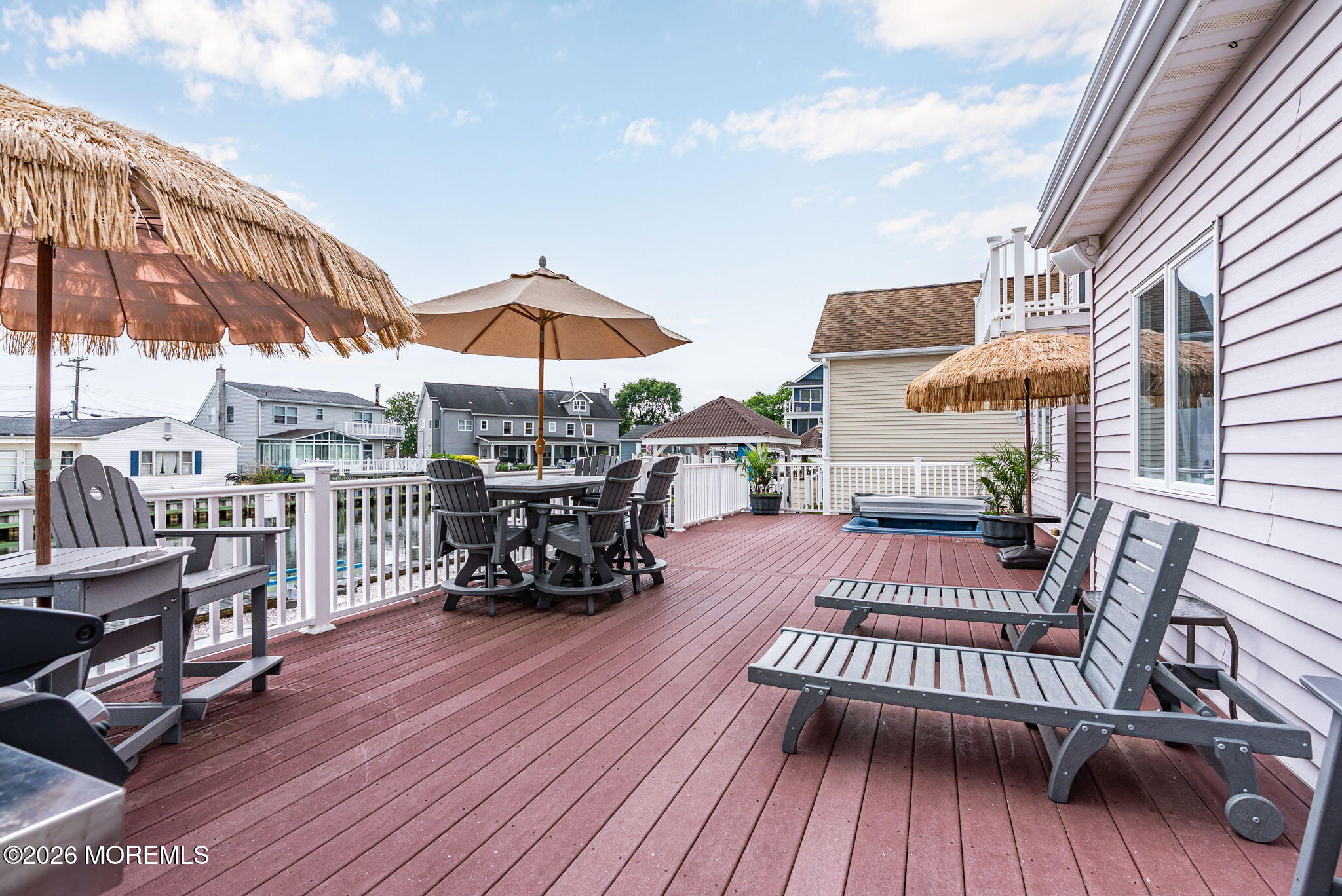 9 Cross Trees Road Brick, NJ 08723 - Photo 73 of 126 a view of a rooftop deck with couch and chairs