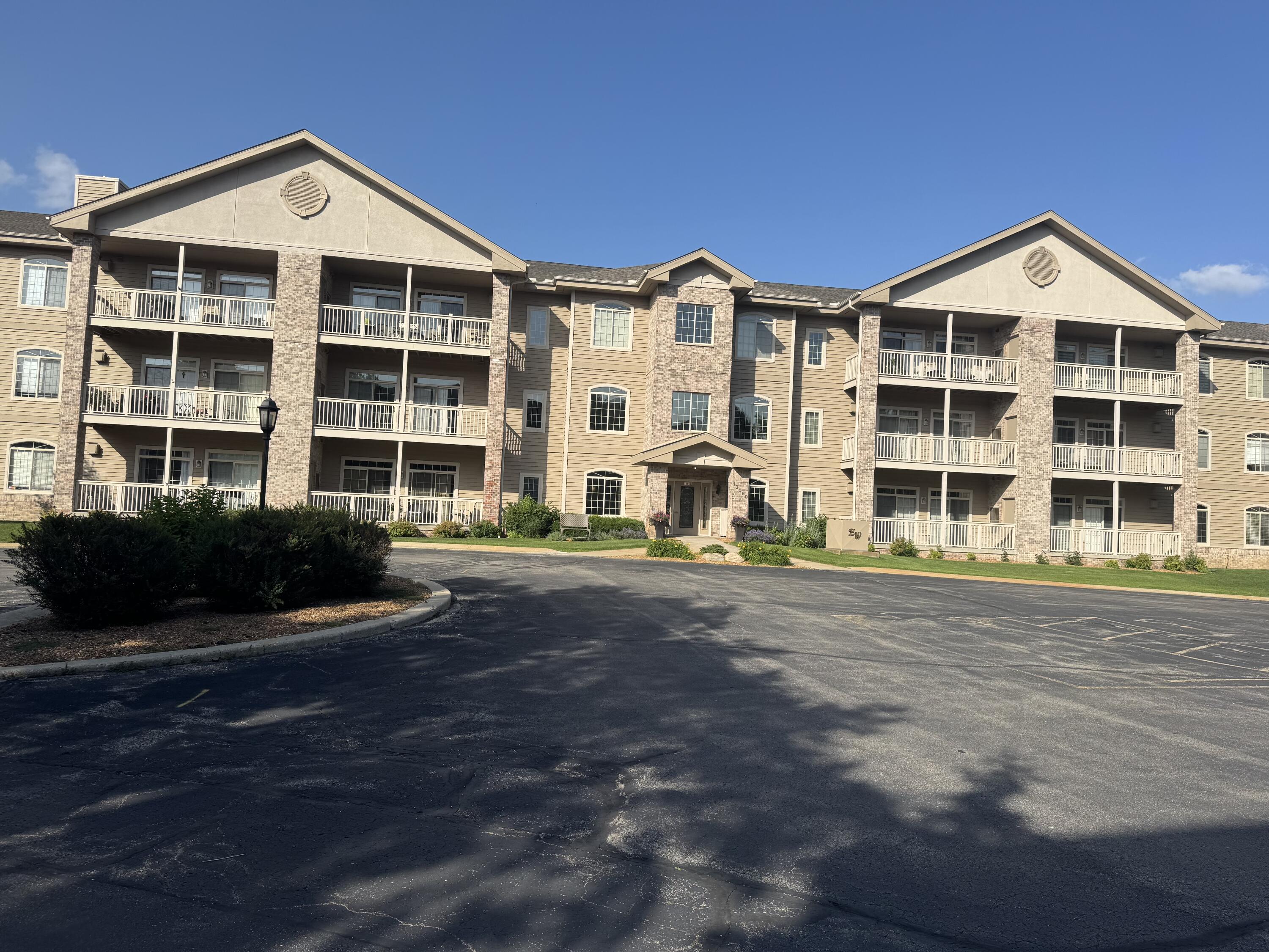 13060 West Bluemound Road, Unit 208 Elm Grove, WI 53122 - Photo 1 of 8 Front of the building