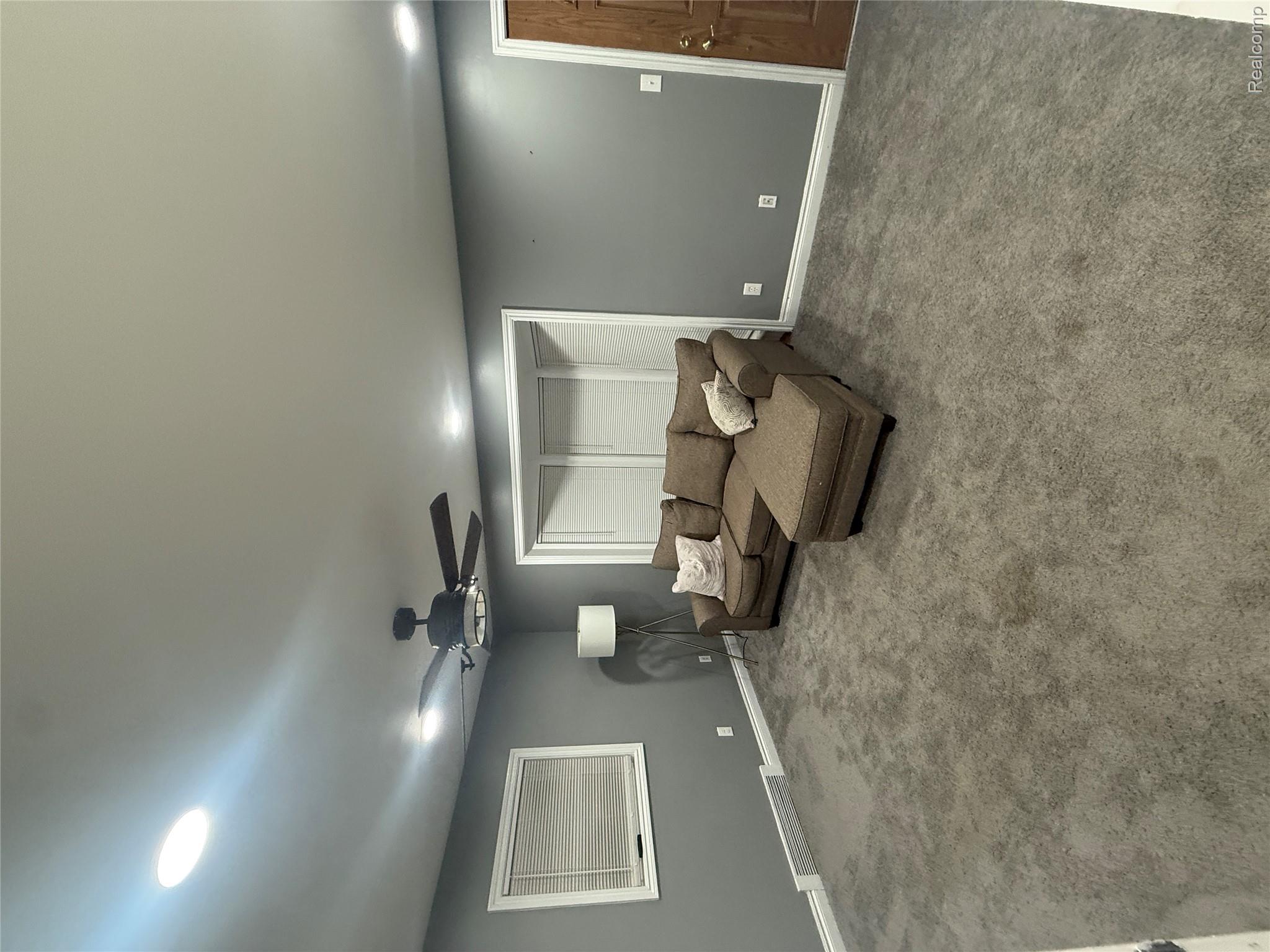 44862 Willis Road Belleville, MI 48111 - Photo 6 of 14 Carpeted living area featuring ceiling fan and recessed lighting