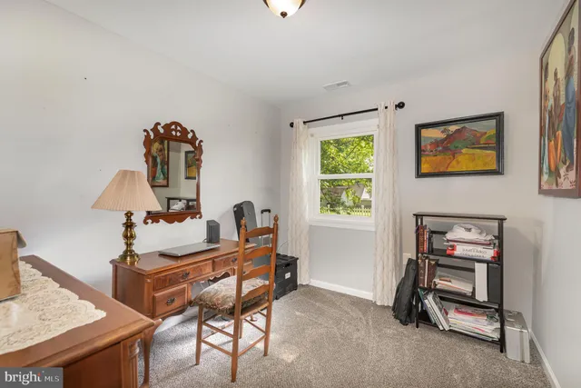 a room with a table and a window