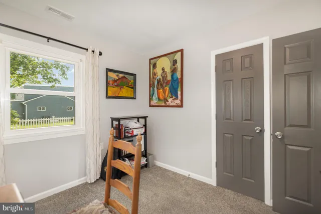 a room with gym equipment and a window