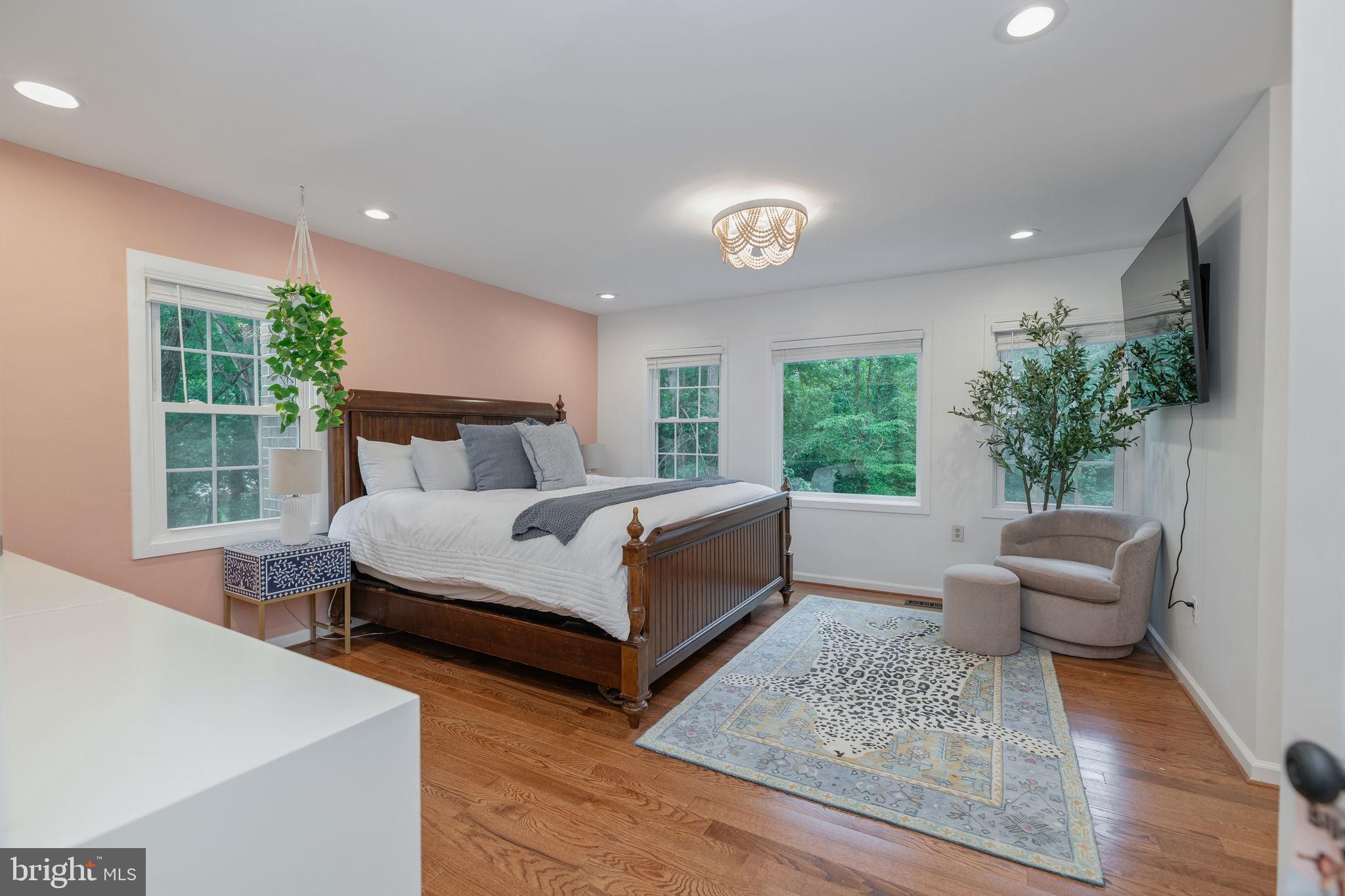 7603 Modisto Lane Springfield, VA 22153 - Photo 21 of 57 a bedroom with a large bed and a large window
