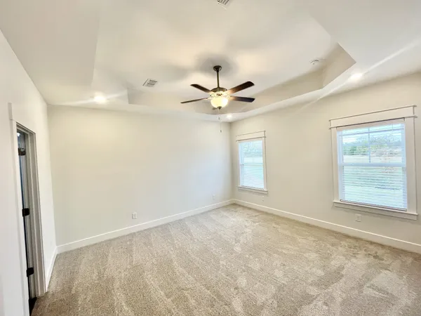 a kitchen with a refrigerator and a stove