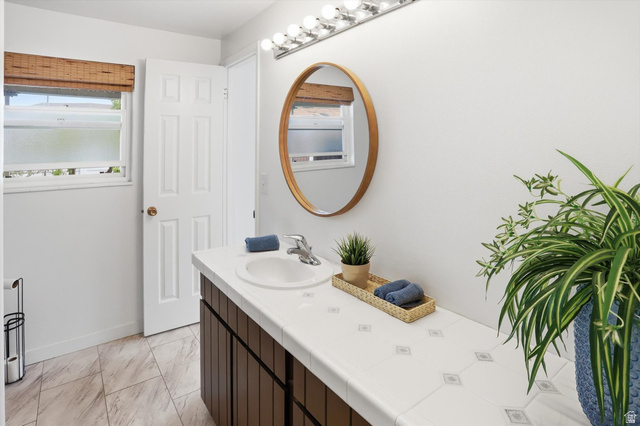 5108 South 2000th Street West Roy, UT 84067 - Photo 27 of 61 Bathroom with vanity and light marble finish floors